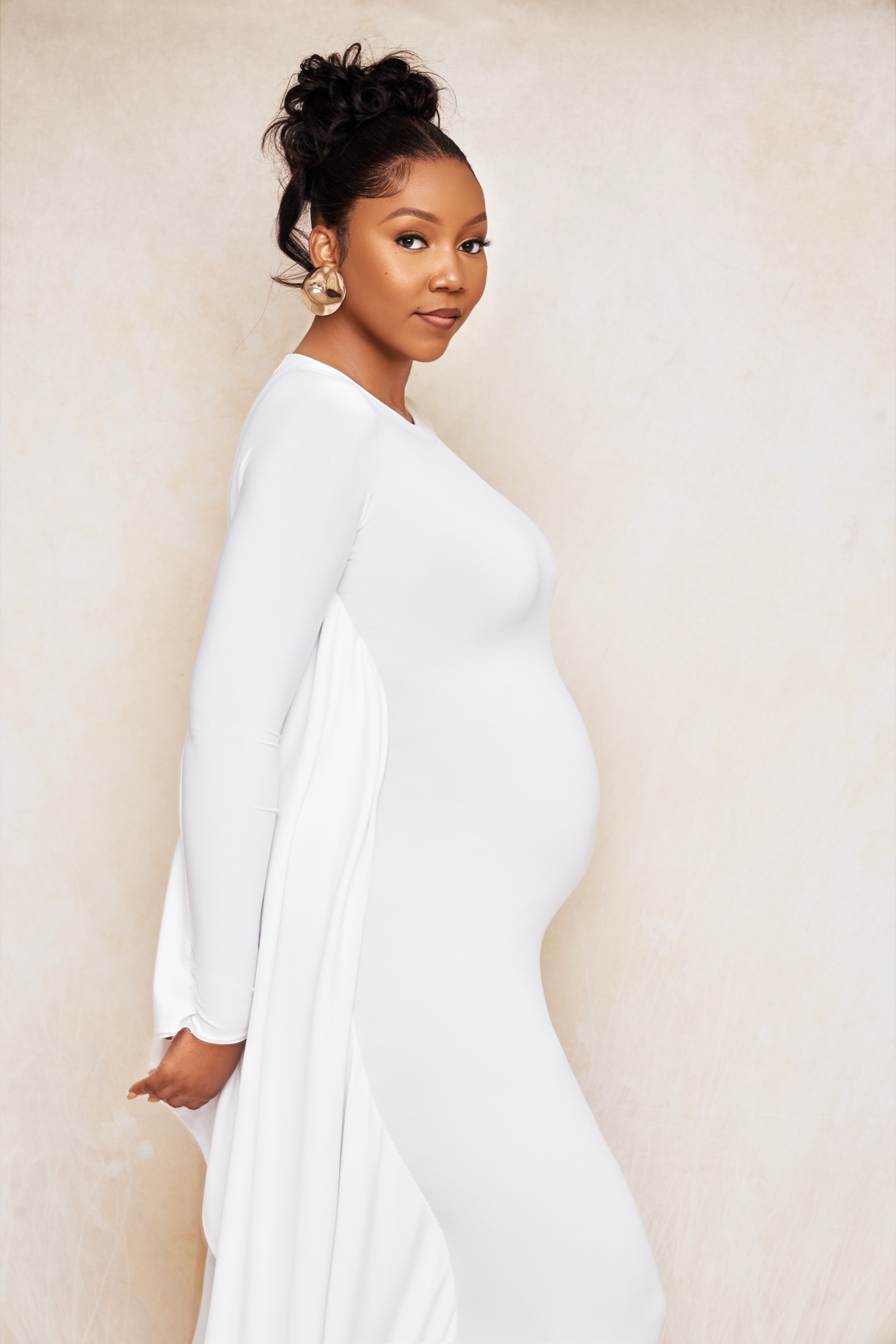 Editorial maternity portrait in an ivory gown, shot at Jepson Myles Studio in Sandton
